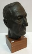 A mid 20th Century bust of a gentleman set on a square mahogany base bearing label inscribed "...