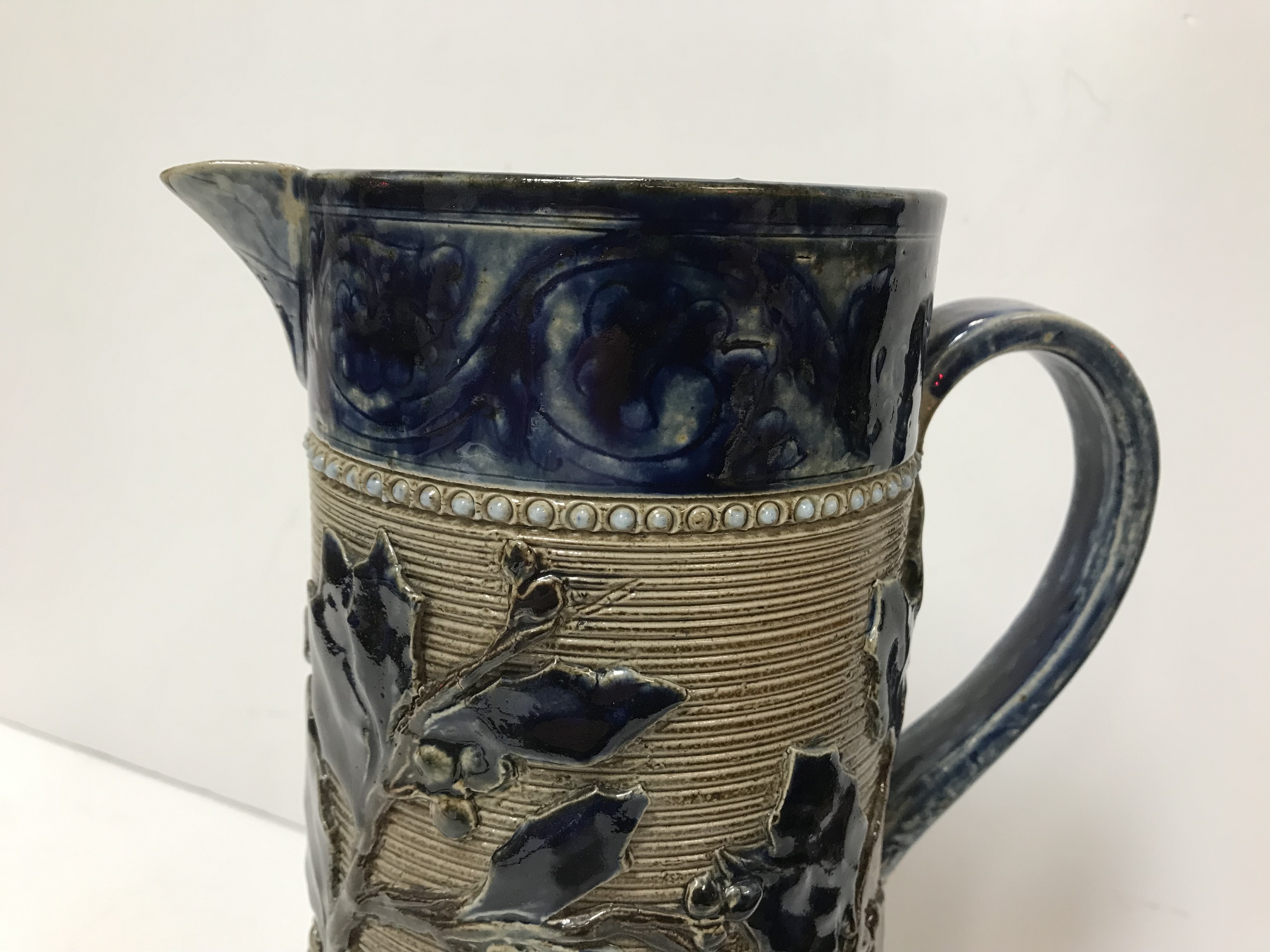 A Victorian glazed stoneware jug with holly decoration, - Image 11 of 27