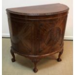 A 20th Century figured mahogany side cabinet in the Georgian style,