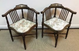 A pair of Edwardian mahogany and inlaid corner salon elbow chairs and a similar pair of standard