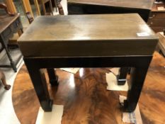 A pair of Chinese stone ink block tables on black lacquered bases,