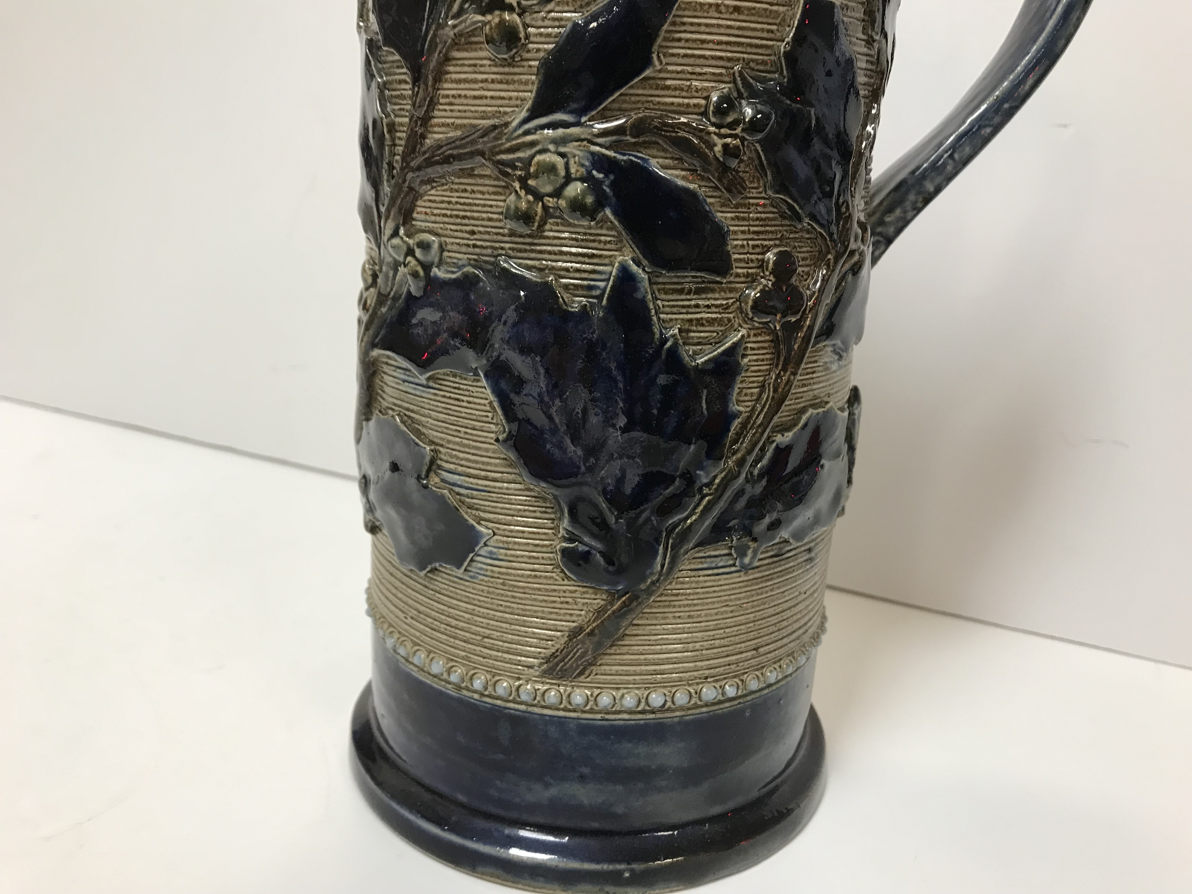 A Victorian glazed stoneware jug with holly decoration, - Image 12 of 27