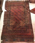 A collection of five vintage Turkamen rugs - a Turkamen rug,