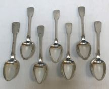 Seven Georgian silver "Fiddle" pattern tablespoons, three with engraved "W" (three by William Eley,