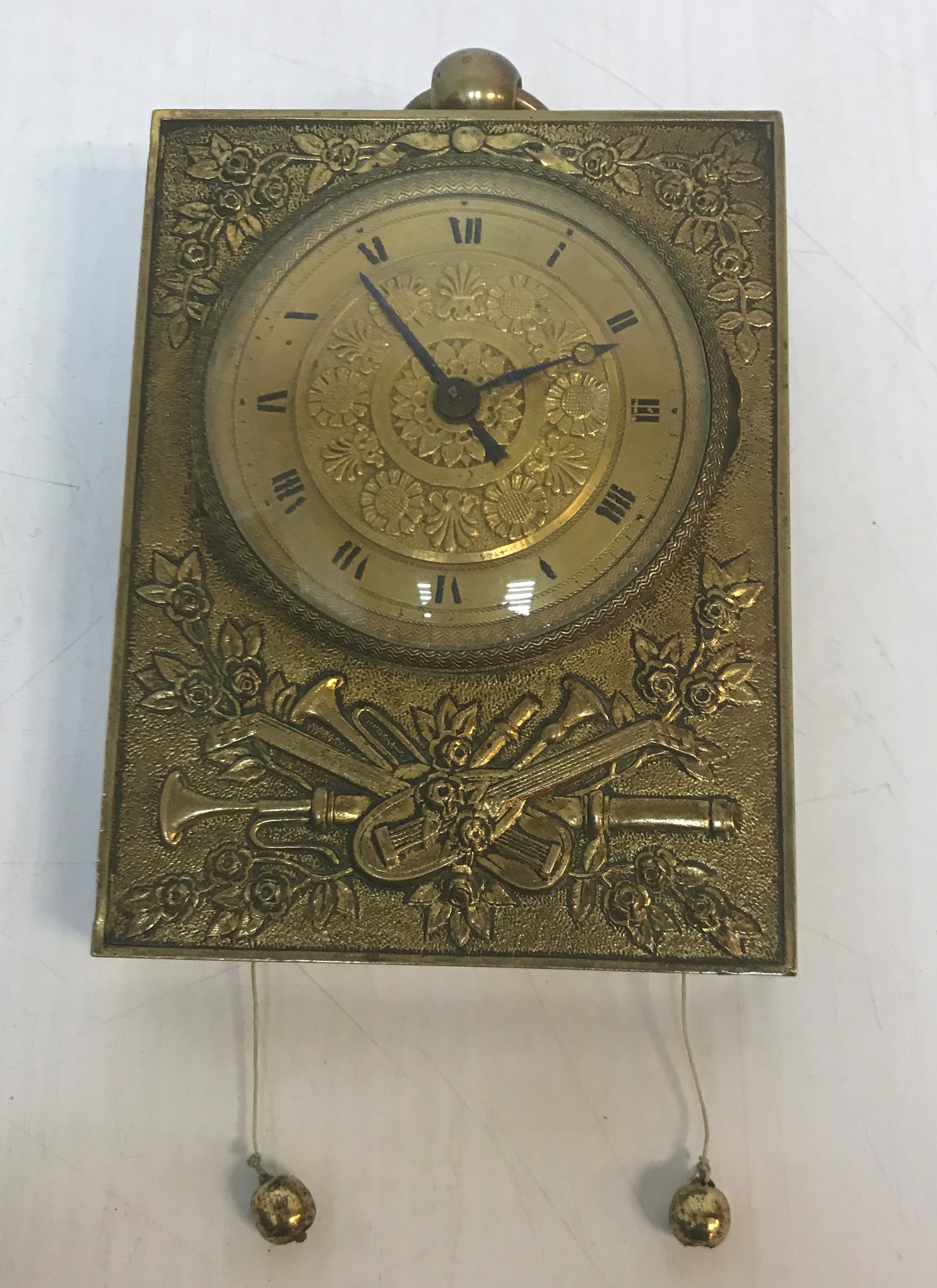 A Continental brass cased repeater wall clock,