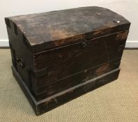 A Victorian oak and iron bound dome top trunk on a plinth base,