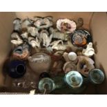 Two boxes of assorted decorative china wares to include various ornamental elephant figures,