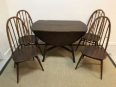 An Ercol elm drop leaf dining table on splayed legs 125 cm x 113 cm x 71.