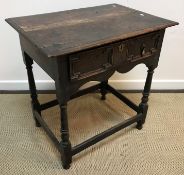 An oak single drawer side table in the 17th Century manner raised on turned legs to block feet