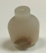 A plain white jade snuff bottle with wax seal,