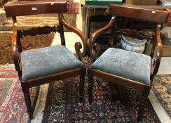 A pair of William IV style bar back carver chairs with drop-in seats on turned front legs,