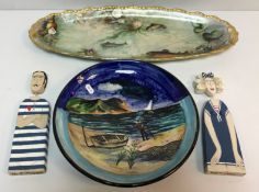 A Songlain Pottery plate decorated with coastal scene with figure and fishing boat and nets in