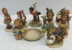 A collection of nine Goebel Hummel figures of children various,
