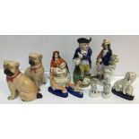 A collection of various Staffordshire figures including poodle with pups 14 cm high,
