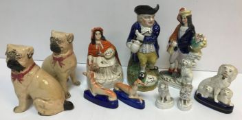 A collection of various Staffordshire figures including poodle with pups 14 cm high,