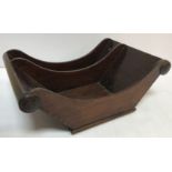 A late George III mahogany two section cheese coaster of scroll form 41 cm wide x 28.