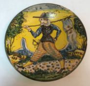 A 19th Century Italian majolica dish, the centre decorated with gentleman carrying a flag,