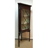 A G Plan teak bookcase cabinet with two glazed doors over two adjustable shelves and two cupboard