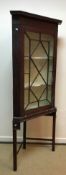 A G Plan teak bookcase cabinet with two glazed doors over two adjustable shelves and two cupboard