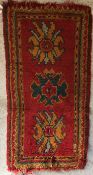 A Turkish rug, the central panel set wit