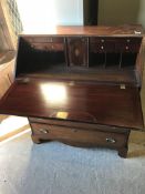 A 19th Century mahogany bureau, the plai