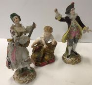 A pair of Chelsea figures of "Man seated