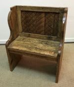 A modern rustic pine pew style bench wit