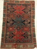 A Shirvan rug, the central panel set wit