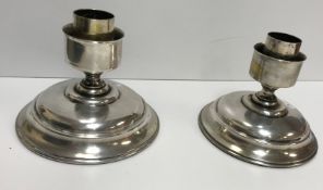 A pair of plated candle light bases of s