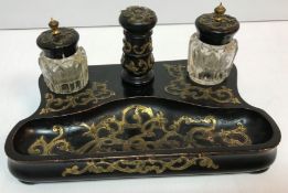 A Victorian ebonised and brass bound des