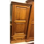 A modern teak two door wardrobe on brack