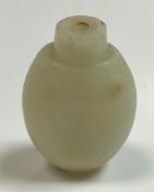 A carved pale jade snuff bottle of flask