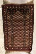 A Bokhara rug, the central panel set wit