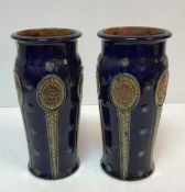 A pair of Royal Doulton blue ground relief work decorated vases, 31.