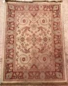 An Oriental rug, the central panel set w