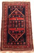 A Belouch rug, the central panel set wit