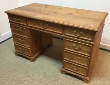 A modern pine double pedestal desk, the