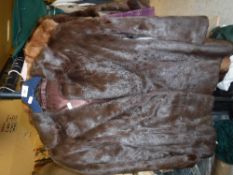 A brown mink jacket with satin lining,