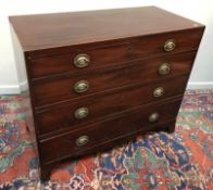 A Regency mahogany and satinwood strung chest of four long drawers, the locks stamped 