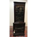 A modern reproduction mahogany corner cabinet in the George III taste,