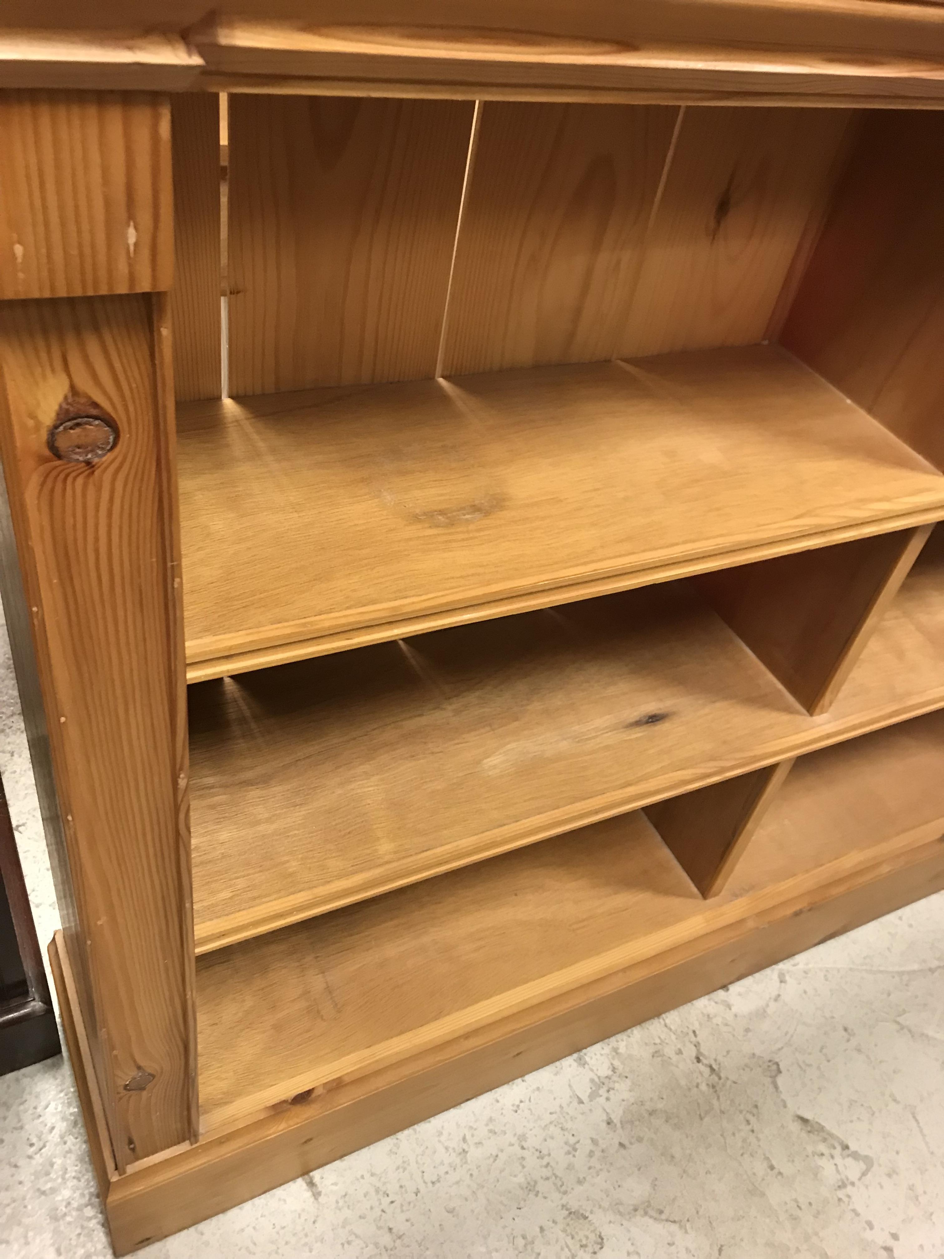 A pair of modern stained pine open bookcases of two banks of three shelves, raised on plinth bases, - Image 13 of 15