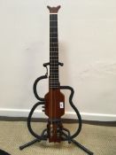 An Aria Sinsonido mahogany travel guitar with gig bag