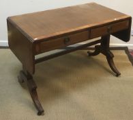 An Edwardian mahogany sofa table in the George III style,