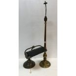 A circa 1900 brass and painted tin desk lamp of typical form and a brass baluster shaped table lamp
