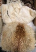 A collection of furs to include an ermine stole, a white fox fur stole,