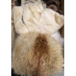 A collection of furs to include an ermine stole, a white fox fur stole,