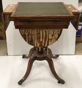 A 19th Century rosewood and cross-banded games / work table with reading slope top enclosing a