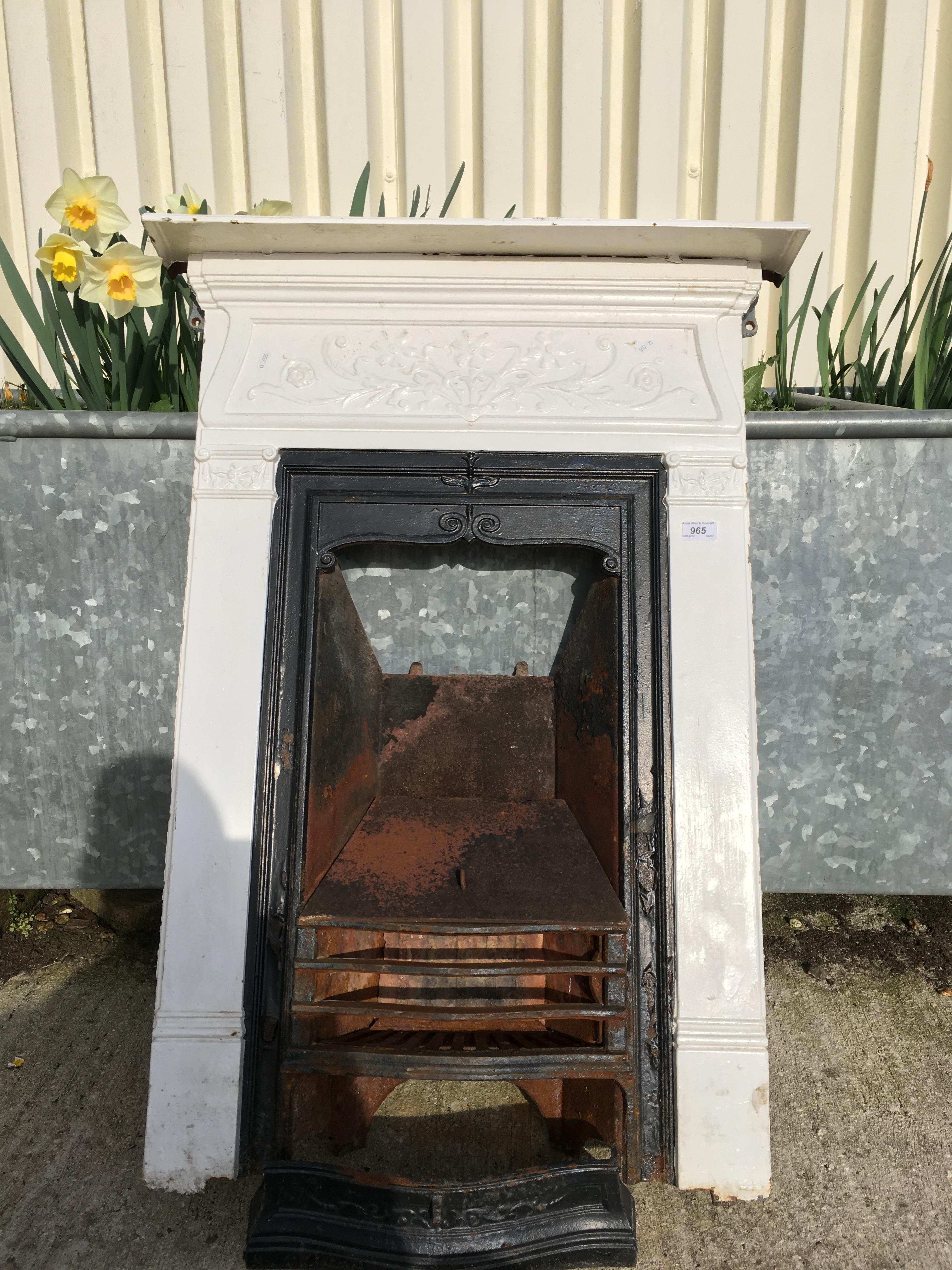 A late Victorian cast iron bedroom fireplace with basket and mantel 70 cm wide x 98 cm high
