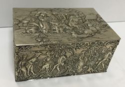 A Dutch white metal hinge-lidded box of rectangular form with embossed figural and landscape