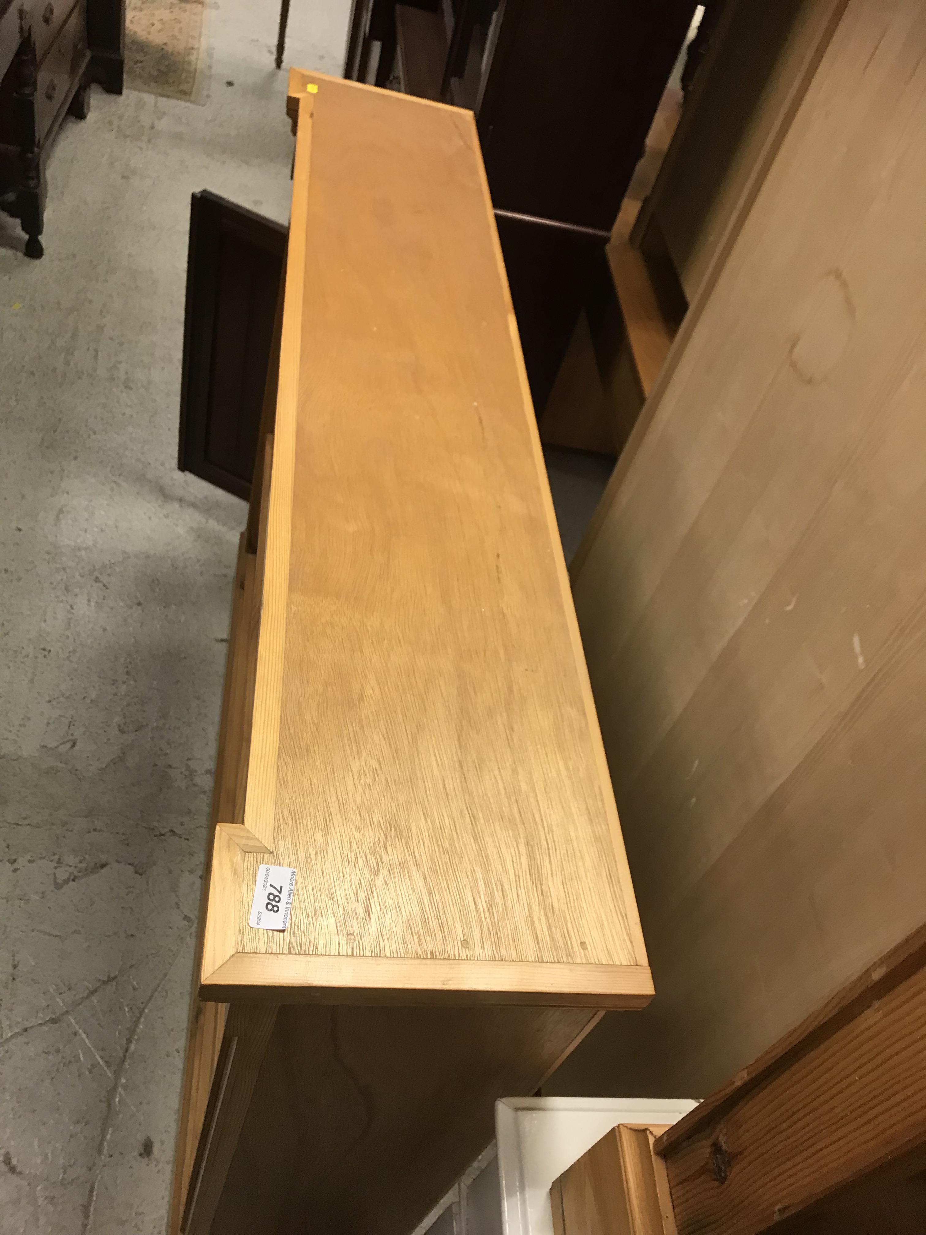 A pair of modern stained pine open bookcases of two banks of three shelves, raised on plinth bases, - Image 9 of 15